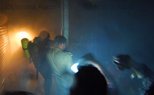 Old Dhaka. October. 2009. Fire fighter in action. ©Monirul Alam