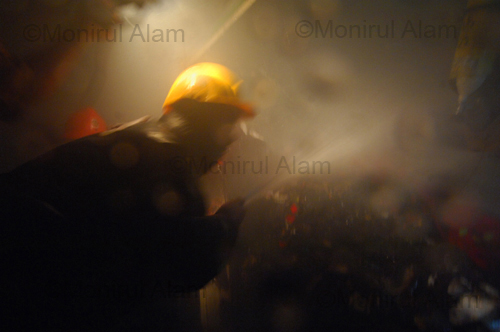 Old Dhaka. October. 2009. Fire fighter in action. ©Monirul Alam