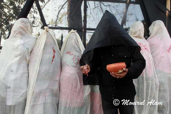 DEC 16 2012-Dhaka, Bangladesh-  Bangladeshi youth protest against the deaths of the garments workers in the Ashulia fire in Dhaka on Sunday  16 December. Reports state that more than 100 people were killed after a devastating fire took place at Tazreen Fashions Limited garments factory at Nischintapur, in Savar on the outskirts of Dhaka, Bangladesh, late on 24 November 2012. © Monirul Alam