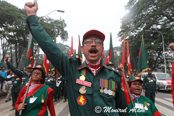 DEC 18 2012-Dhaka, Bangladesh- Members of Muktijodha Sangsha, a non-political welfare association of ex-combatants form the war of liberation in 1971, during a protest rally against recent Jamaat-eIslami activity and to demand and ensure the quick trail of war criminals. © Monirul Alam