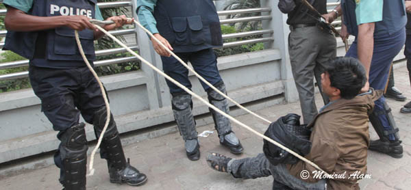 DEC 10 2012-Dhak, Bangladesh- Police arrests many of BNP activist including their part sectary Mirza Fakrul   during the Pro- Hartal activities on Monday at Dhaka. The activists of BNP and its close ally Jamaat-e-Islami set fire to at least nine buses and vandalized many others in the capital on the eve of Tuesday's dawn-to-dusk nationwide strike. They are demanding restoration of the caretaker government system. © Monirul Alam