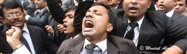DEC 11 2012-Dhak, Bangladesh- BNP lawyers shout slogan in form of CMM court during the Hortal hour.BNP and its close ally Jamaat-e-Islami observed dawn-to-dusk nationwide strike on Tuesday. They are demanding restoration of the caretaker government system. © Monirul Alam